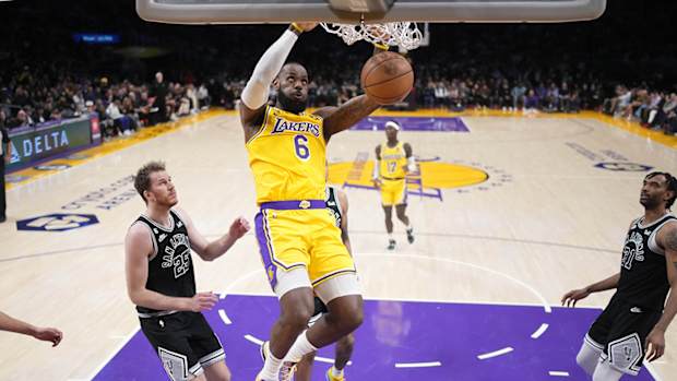 Los Angeles Lakers forward LeBron James (6) dunks against the San Antonio Spurs in the first half at Crypto.com Arena. The Lakers defeated the Spurs 113–104.